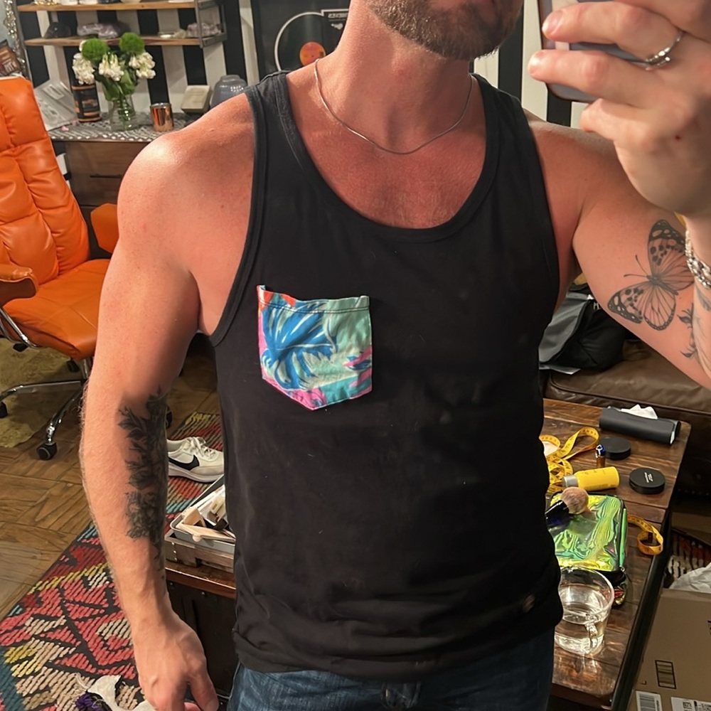 Mens beach vacation black tank top with floral detail